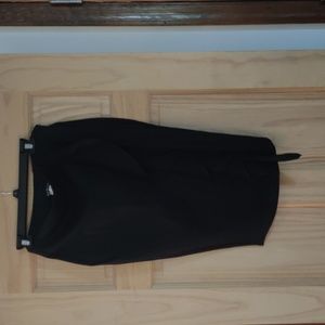Black pull-on skirt with front ruffle and back slit; no pockets; size M